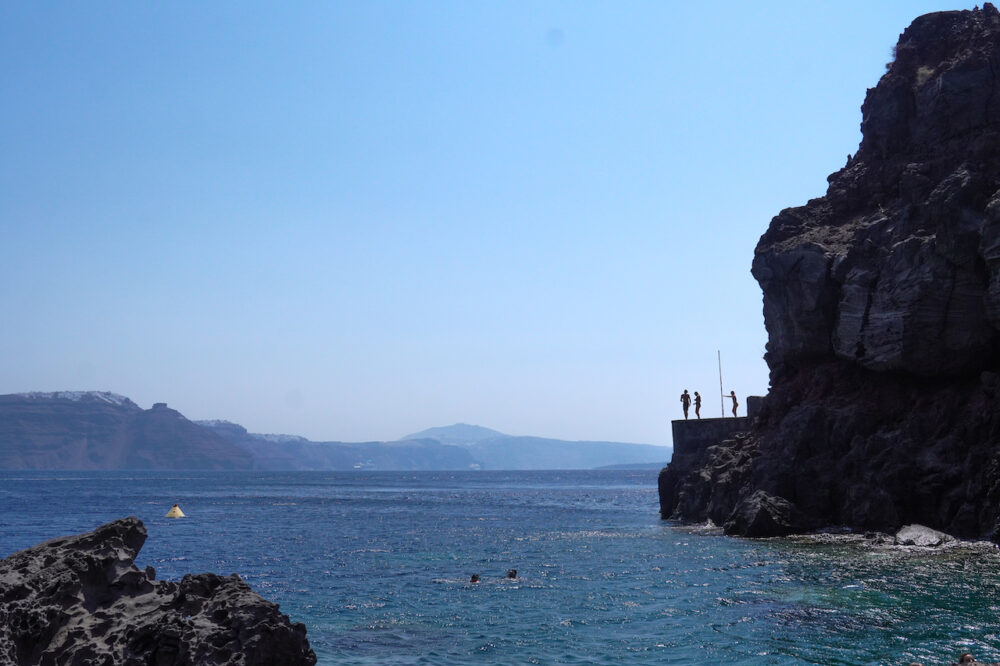 Cliff Jumping in Amoudi Bay Santorini Greece